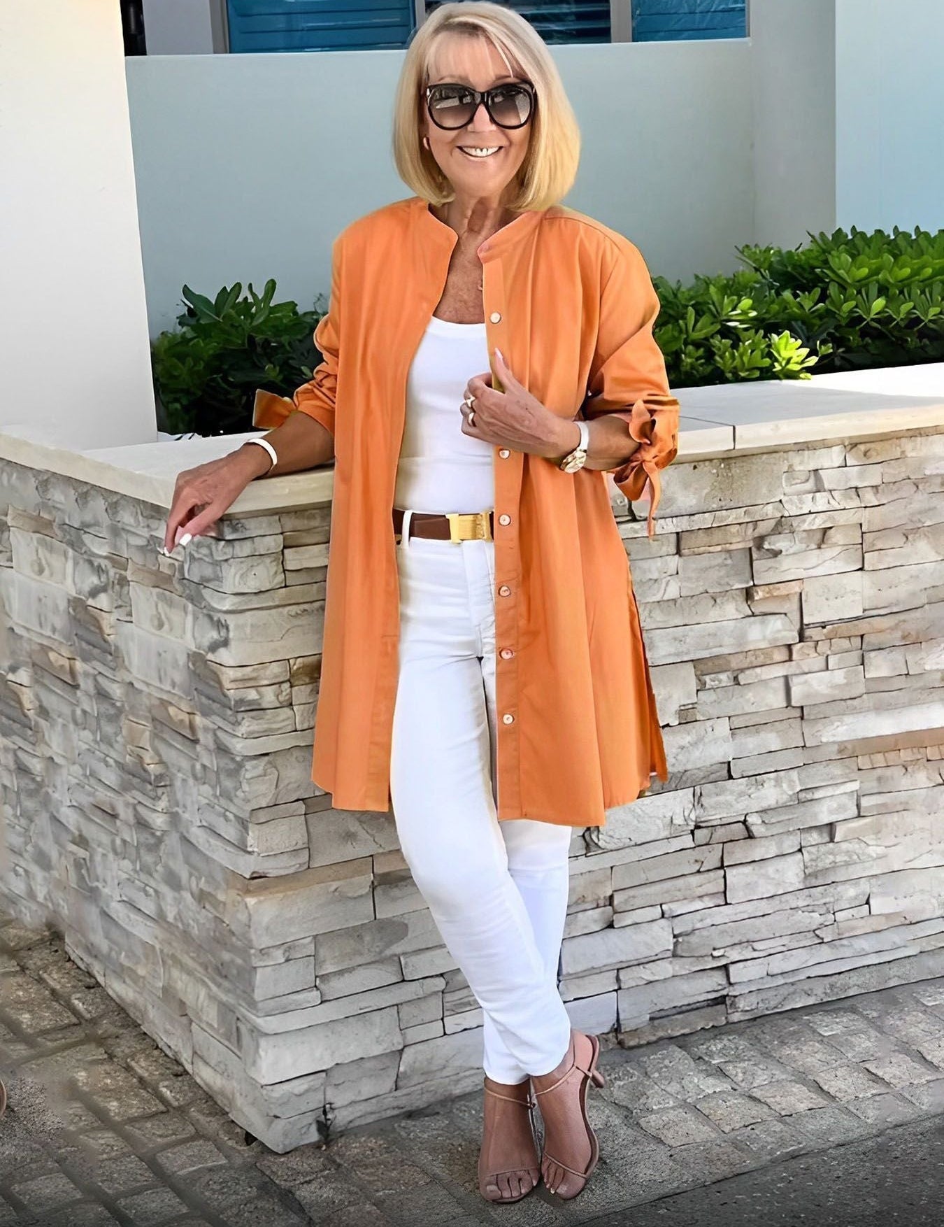 Blusa larga abotonada para mujer con espalda plisada y mangas anudadas