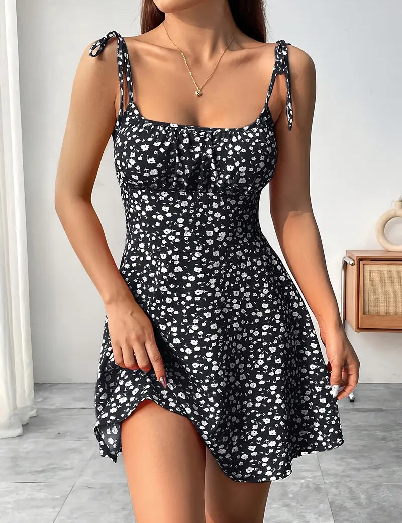 Vestido mini floral para mujer con tirantes anudados y bajo acampanado