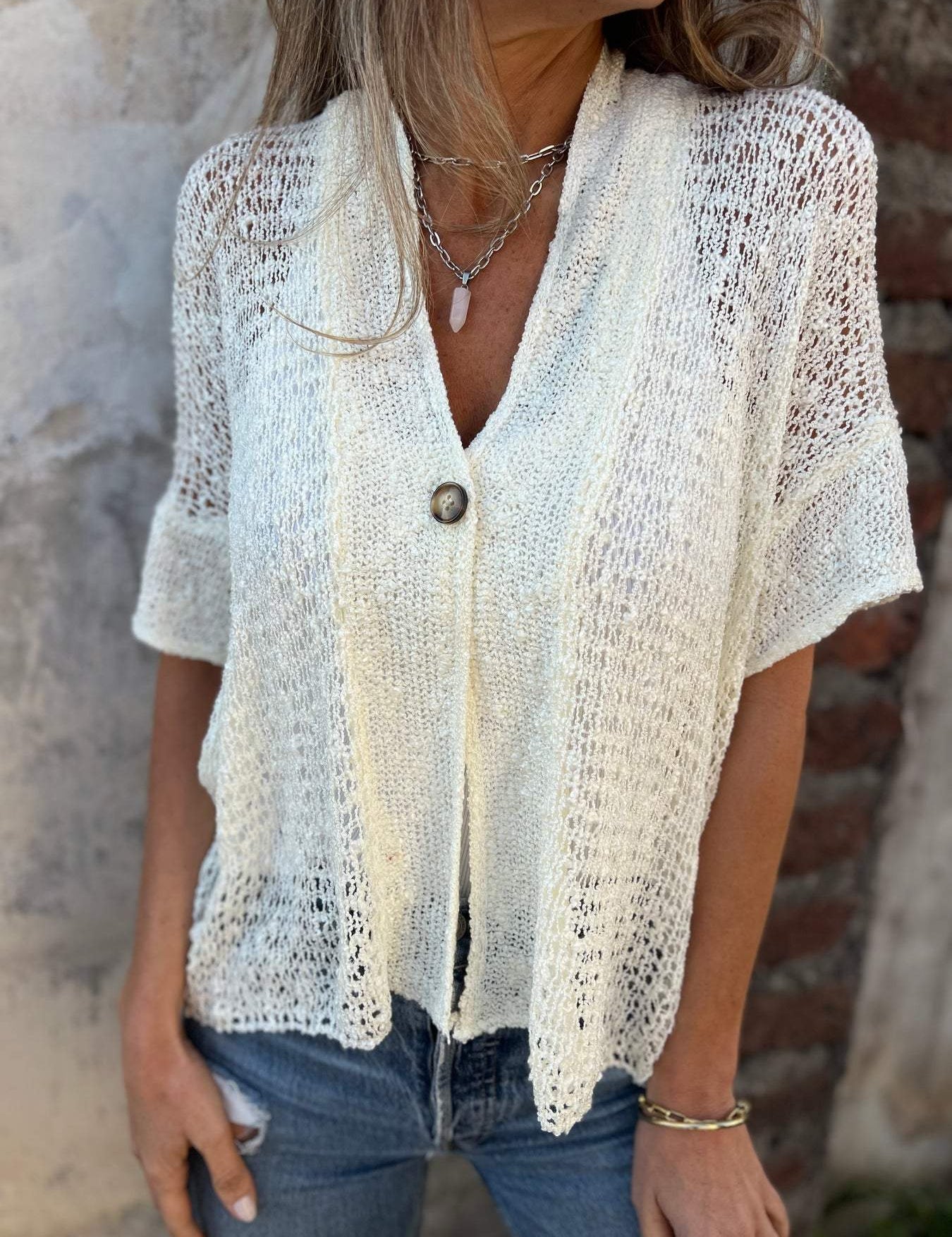 Top de punto de manga corta para mujer con botones en la parte delantera