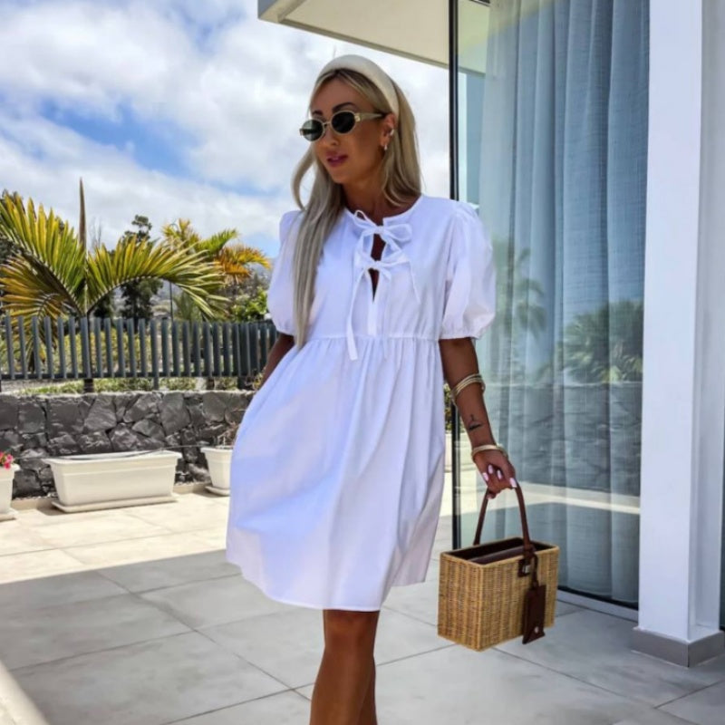 Vestido mini de mujer con mangas abullonadas, abertura frontal y lazos